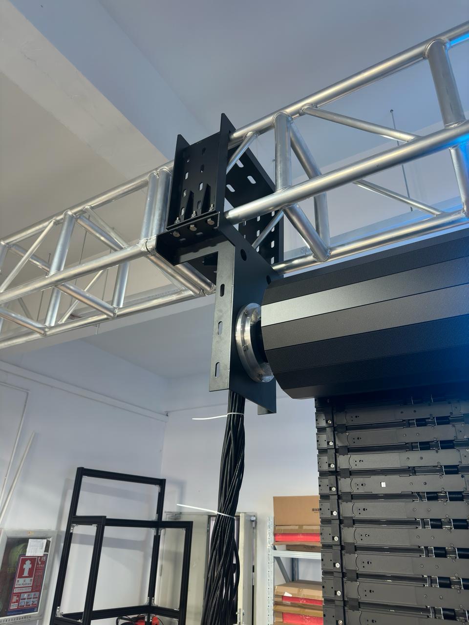 Close-up of roller bearing and mounting plate on rolling LED wall